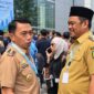 Bupati Luwu H. Patahudding bersama Bupati Sidrap Syaharuddin Alrif di lokasi Rakornas TPAKD, Jakarta, Kamis (22/10). (ist)